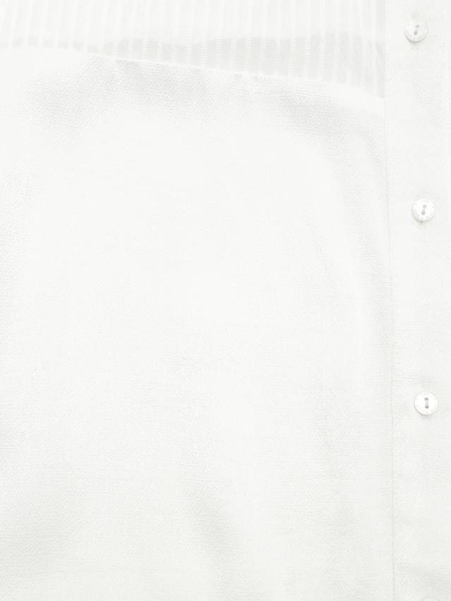 Блуза жіноча із текстильної тканини, комбінована с довгим втачним рукавом і манжетами по низу. По переду і спінке виконані - 8